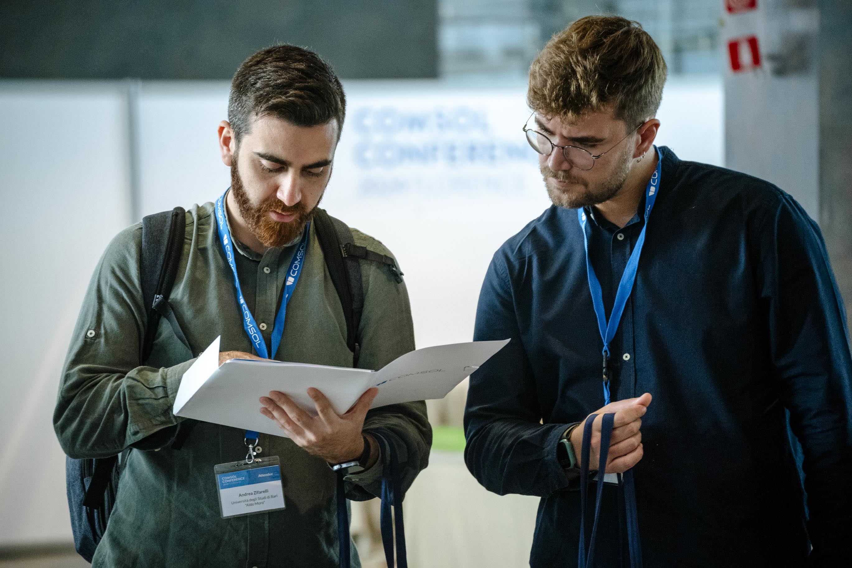 Attendees looking over the program.